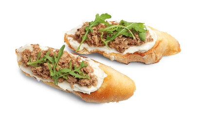 Delicious bruschettas with tuna, cream cheese and arugula isolated on white, top view