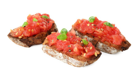Tasty bruschettas with tomatoes and basil isolated on white