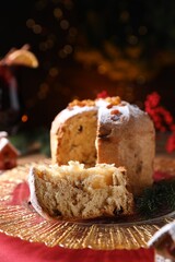 Christmas food. Delicious Panettone cake and festive decor on table, closeup