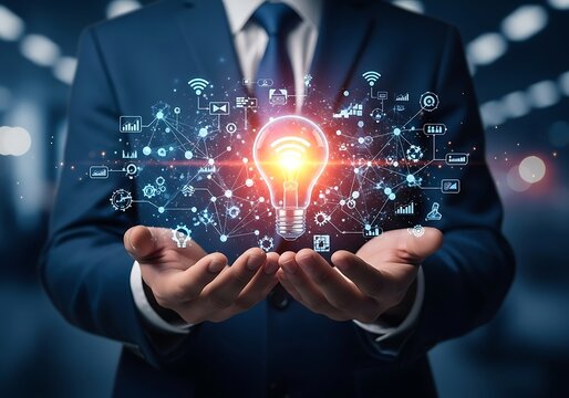 A businessman holds a glowing light bulb surrounded by digital icons, representing innovation, technology, and the generation of creative ideas