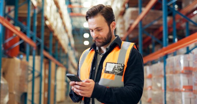 Man, phone and worker in warehouse for shipping, distribution schedule or inventory management. Mobile, logistics and person with app to check stock, online communication and email for supply chain - Powered by Adobe
