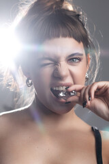 Young Girl Biting a Diamond with a Sassy Wink
