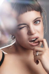 Young Woman with Expressive Blue Eyes Flirting
