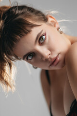 Portrait of a Young Woman with Expressive Blue Eyes