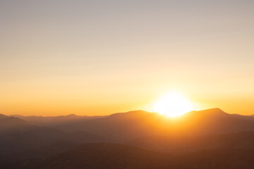 Sunset over the mountains. Silhouette of the mountain range