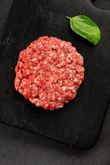 Raw cutlet meat burger ground meat beef, pork fresh natural product tasty snack delicious gourmet food background on the table rustic top view copy space