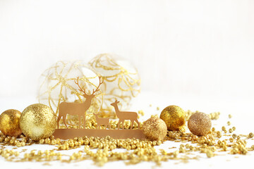 christmas toy deer family and festive golden decoration. winter festive composition. New year, Christmas, Advent holidays concept. magic atmosphere, fairytale