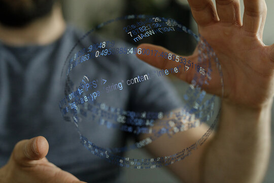 Close up of a hand interacting with a digital interface, featuring a sphere with code elements, perfect for technology and futuristic
