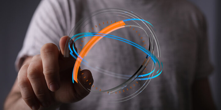 A person's hand interacting with a holographic, digital globe, symbolizing technology, global communication, and interconnectedness.