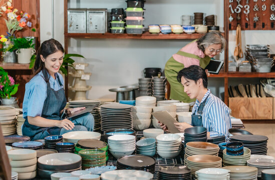 Mother, Son, and Daughter Managing Family Business Ceramic Shop - Powered by Adobe