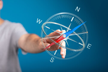 Hand holding a compass for navigation and direction. Shows concepts of guidance, exploration, and travel. Ideal for business, future