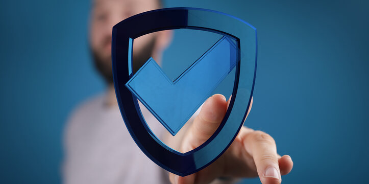 Concept of cybersecurity, protection, data safety, online safety with a hand touching a blue shield icon with a checkmark symbol agai - Powered by Adobe