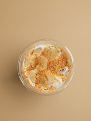 A glass of coffee with milk or cream