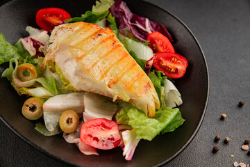 Grilled chicken breast salad chicken breast tomato, green leaf lettuce, salad mix snack vegetables natural product tasty snack fresh gourmet food background on the table rustic top view copy space
