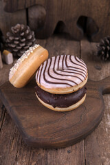 An assortment of donuts on a wooden background