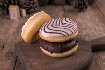 An assortment of donuts on a wooden background