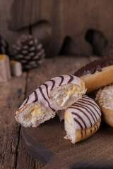 An assortment of donuts on a wooden background