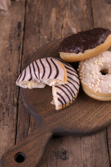 An assortment of donuts on a wooden background