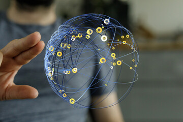 Abstract image featuring a hand touching a 3D rendered sphere representing global connections, data, and technology, conveying a sens © vegefox.com