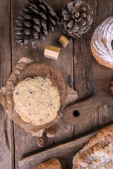 Various types of desserts and pastries on an old wooden background