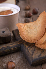 Various types of desserts and pastries on an old wooden background