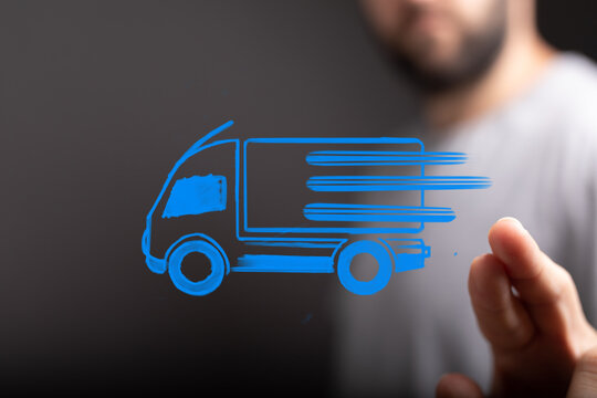 A man's hand interacts with a glowing blue digital delivery truck icon, symbolizing fast, modern logistics and efficient shipping services. - Powered by Adobe