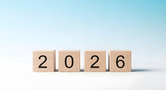 Wooden letter tiles spelling out the year 2026 against a soft blue gradient background
