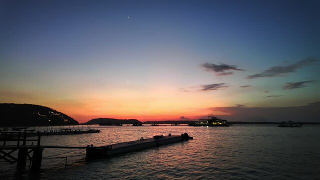 Enchanting sunset over ocean pier, where sky transforms into canvas of colors, beautiful ambiance creating serene atmosphere perfect for relaxation