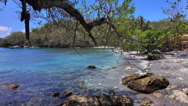 view of tropical beach in breeze with ocean waves, travel concept, beauty of nature, Indonesia