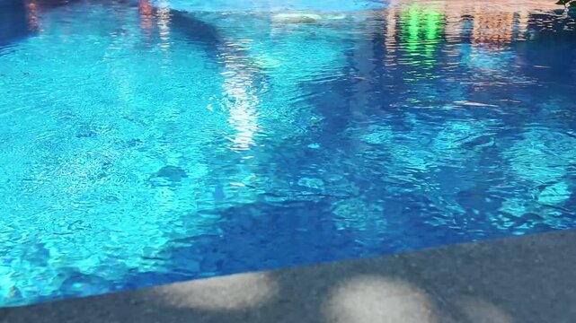 Serene scene of pool water, inviting viewers to experience relaxation and rejuvenation during blissful vacations, copy space