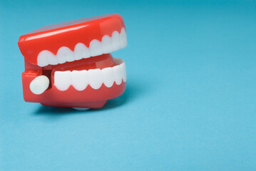 Wind-up teeth against a blue background