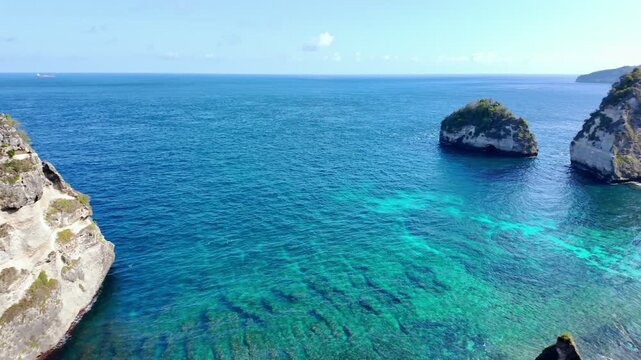 top down perspective of Diamond Beach in Indonesia, vividly illustrating clear waters, golden sands and stunning geological features creating heavenly escape
