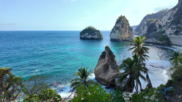 aerial view of Diamond Beach showcases vibrant contrasts of emerald cliffs, shimmering water, embodying Indonesia natural beauty