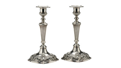 Pair of ornate silver metal candle holders rests against a solid dark background