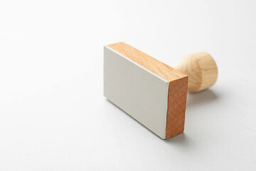 One wooden stamp on white background, closeup. Space for text