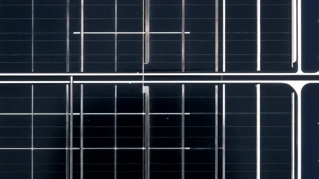 Close up of solar panels showing grid pattern and texture.