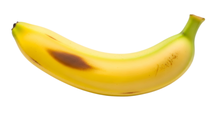 Single ripe banana with a noticeable brown bruise sits isolated against a deep black background