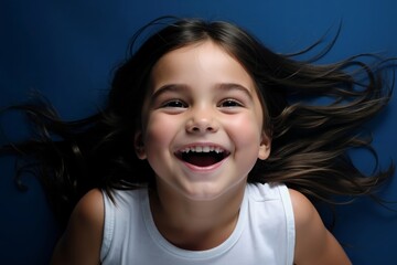 A little girl with her hair blowing in the wind