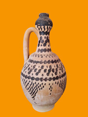 Traditional Decorative Ceramic Jug on Vibrant Orange Background