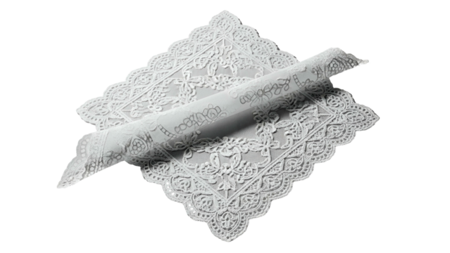 Intricate white lace fabric exhibits delicate floral patterns partially rolled up on a dark background