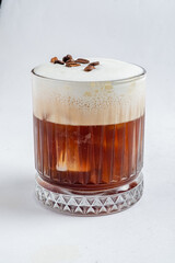 Enjoy this coffee cocktail with a creamy froth and aromatic spices that entice the senses