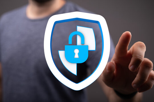 Concept of cybersecurity, protection and privacy in business or personal life. Businessman touching a digital shield, lock and key fo