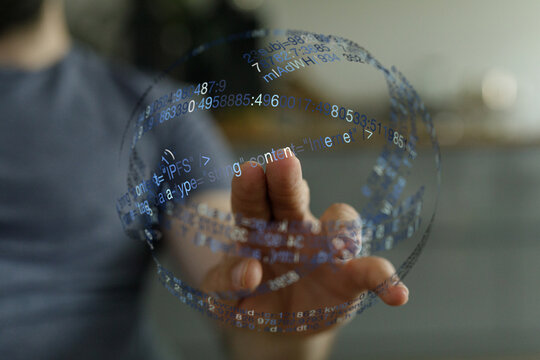 Person holding a digital data sphere, symbolizing technology, innovation, and future concepts in a modern setting. Ideal for illustra