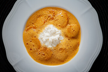 Warm soup with tender dumplings and creamy cheese offers pure comfort and satisfaction