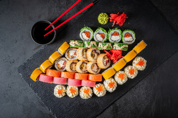 Colorful sushi platter with assorted rolls and garnishes for a stylish gathering