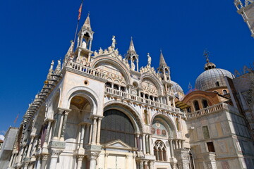 ornate Byzantine-Gothic facade of St. Mark's Basilica in Venice