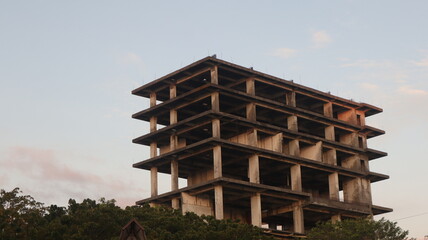 high rise building under construction with a clear sky background