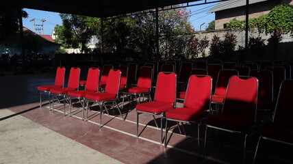 red chairs arranged neatly in the office yard