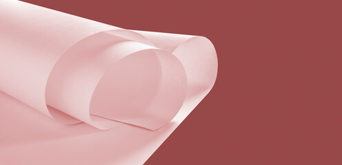 Long sheets of paper from a roll of pink tone.