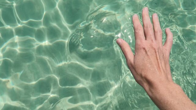 Woman's Hand Touching Tropical Summer Water Pensacola Beach, Florida